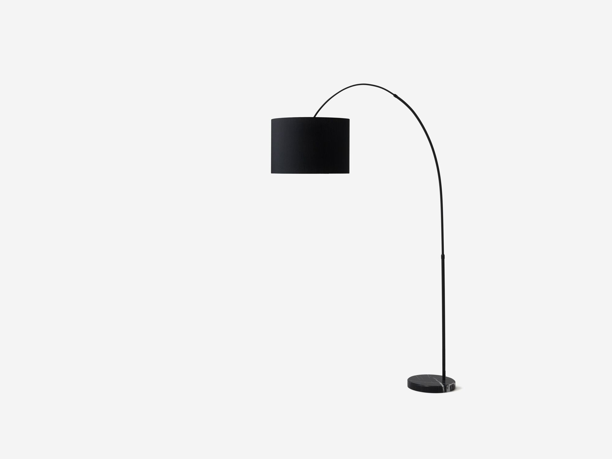 Side view of black arc floor lamp